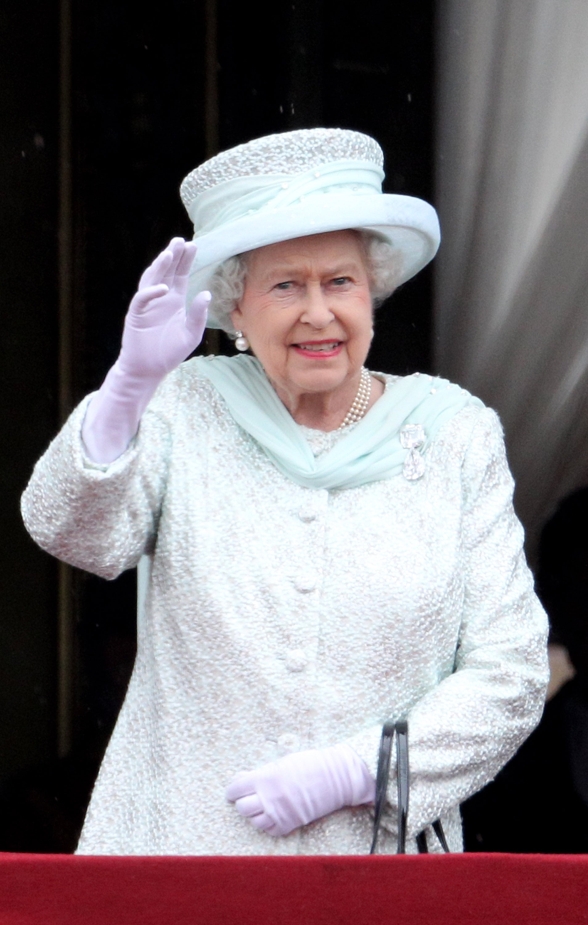 Queen Elizabeth II waves to the crowds at her Diamond Jubilee in 2012