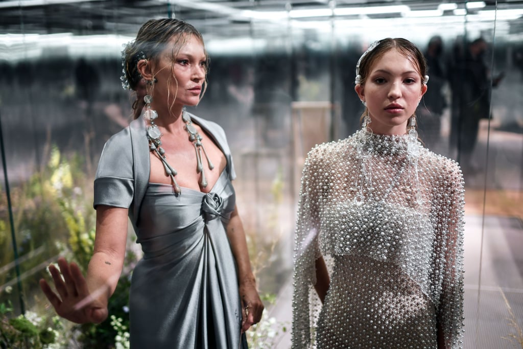 Lila Grace Moss-Hack has clearly learned a thing or two from her supermodel mom, Kate Moss. On Jan. 27, the two walked the runway together for the first time at the Fendi spring/summer 2021 couture show during Paris Fashion Week, which also marked designer Kim Jones's first collection as the brand's creative director. "The importance of family — both real and chosen — is celebrated through the cast who model the collection, who each inhabit glass vitrines transformed into rooms of their own," the show notes read. Jones continued, "Fendi represents artisanal quality of the highest order, and it is all about family."
The 18-year-old model, who is Kate and former partner Jefferson Hack's only child, strutted down the catwalk first, in a stunning beaded caped gown over a bodysuit. Her mom followed shortly after, wearing an elegant embellished satin gown. Afterwards, the pair also posed together in a glass box for attendees to get a closer look at their couture looks. Joined by the likes of Naomi Campbell, Demi Moore, and Bella Hadid, the show was certainly a star-studded affair.
Lila made her runway debut just a few months ago at Paris Fashion Week, where she opened Miu Miu's spring/summer 2021 show in October. It's clear the supermodel genes run strong — though Lila is only 18 years old, she's already making a name for herself in the modeling world. Ahead, see photos of the mother-daughter duo working it at the Fendi show.

    Related:

            
            
                                    
                            

            Chanel&apos;s Spring Couture Show Was a Glamorous Folklore Wedding For the Whole Family