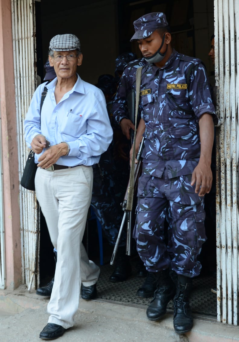 French serial killer Charles Sobhraj (L) is escorted by Nepalese police to a waiting vehicle after a hearing at a district court on a case related to the murder of Canadian backpacker Laurent Ormond Carriere, in Bhaktapur on June 12, 2014. Sobhraj, a Fren