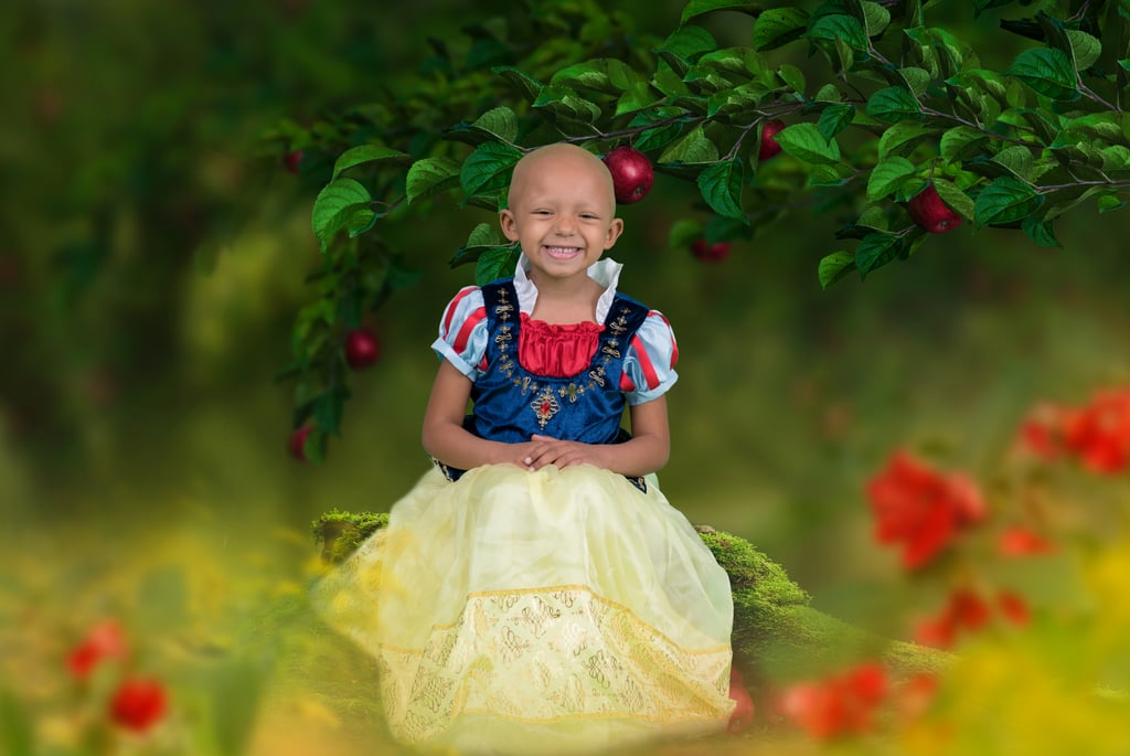 Arianna Dressed as Snow White in Front of an Apple Tree