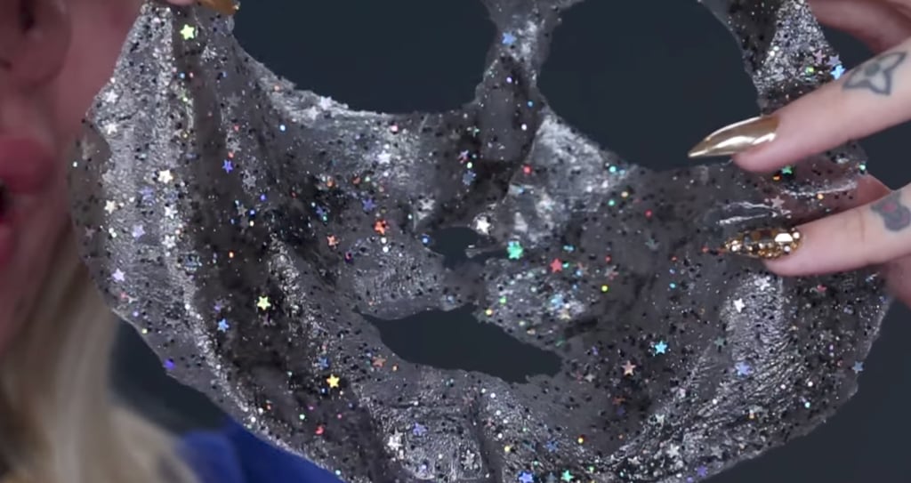 The final, intact result truly is a thing of beauty. For the sake of the environment (and a clean bathroom), Jeffree urged us to dispose of the Glitter Mask accordingly. "Don't flush it down the toilet, throw it in the sink. Peel it off, wave it around, and throw it in the trash."