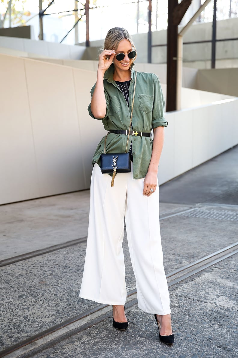 A belted blouse over wide-leg trousers