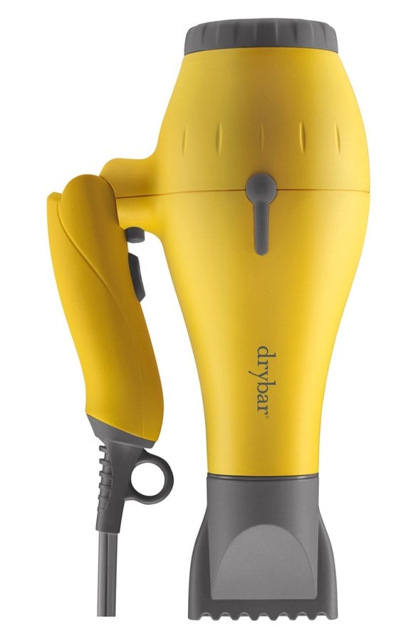 "Baby Buttercup! Buttercup's baby sister travel dryer is an essential for busy ladies on the go. It features the same ionic goodness as Buttercup which dramatically increases and improves the condition of the hair by increasing shine and reducing frizz." 
Drybar Baby Buttercup Travel Blowdryer ($135)