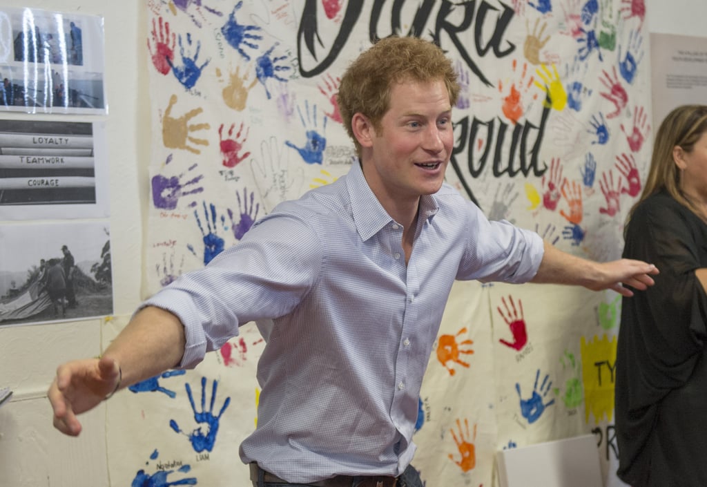 Prince Harry Puts Purple Handprint on Photographer's Head