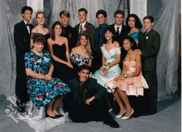 "Oh, the '90s! Floral prints and satin ruffles. You can't tell because of the girl in front of me, but my dress is covered in teal sequins [pictured back row, right]. I still own the dress and plan on wearing it when I turn 40. I'm pretty sure it's going to be back in by then."
— Sabrina Eldredge 