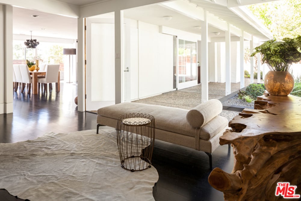 Natural light floods every inch of the window-filled home.