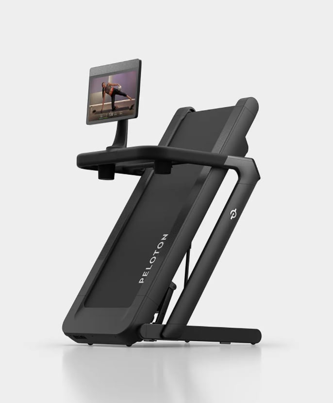 Peloton Tread Flex ($2,195)
Meet Peloton's first folding design! Made with small spaces in mind, now you can easily access Peloton's high-level equipment and well-loved virtual classes without having to devote large real estate in your home. Plus, the ultra-quiet feature makes this ideal for apartment living or shared environments. Our editor put the new launch to the test and shared her initial thoughts.
Editor Quote: "This treadmill is sleek and folds upwards for extra space when you're done with your workout. I love that the screen is so massive, making it ideal for watching workout classes or even your favorite TV show while you jog or walk. The running/walking experience itself is quite smooth and not excessively loud." — Sara Abdelbarry, social media design coordinator