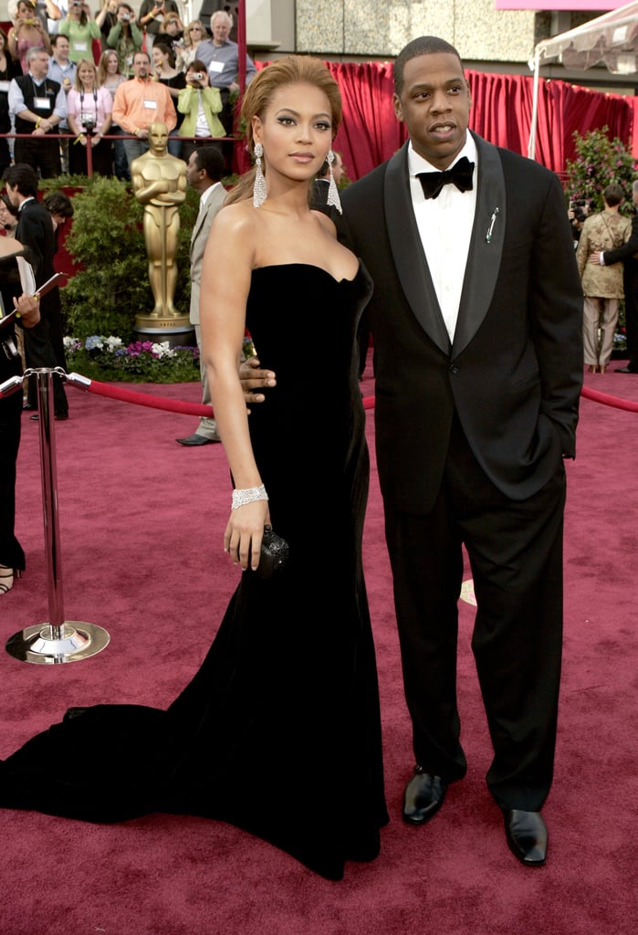 Beyoncé and JAY-Z chose to match in luxe fabrics for the 2005 Oscars, with Bey in this incredible vintage Versace gown and chandelier earrings.