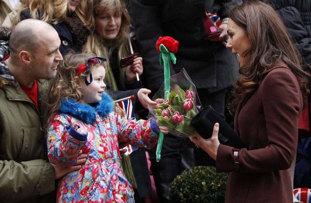 Kate was greeted with a toy rose from fans outside Liverpool's Alder Hey Children's Hospital on Valentine's Day in 2012.