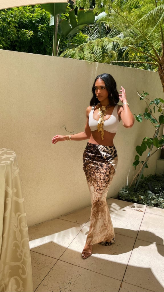 Lori Harvey Styles a White Bra With a Vintage Leopard Skirt