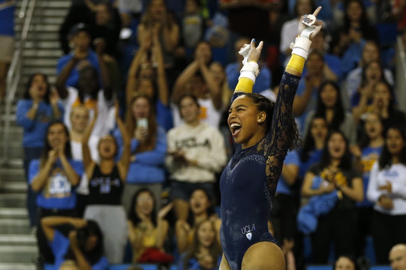 LOS ANGELES, CALIFORNIA - JANUARY 21: UCLA's Margzetta Frazier celebrates after completing uneven bars during at PAC-12 meet against Arizona State at Pauley Pavilion on January 21, 2019 in Los Angeles, California. (Photo by Katharine Lotze/Getty Images)