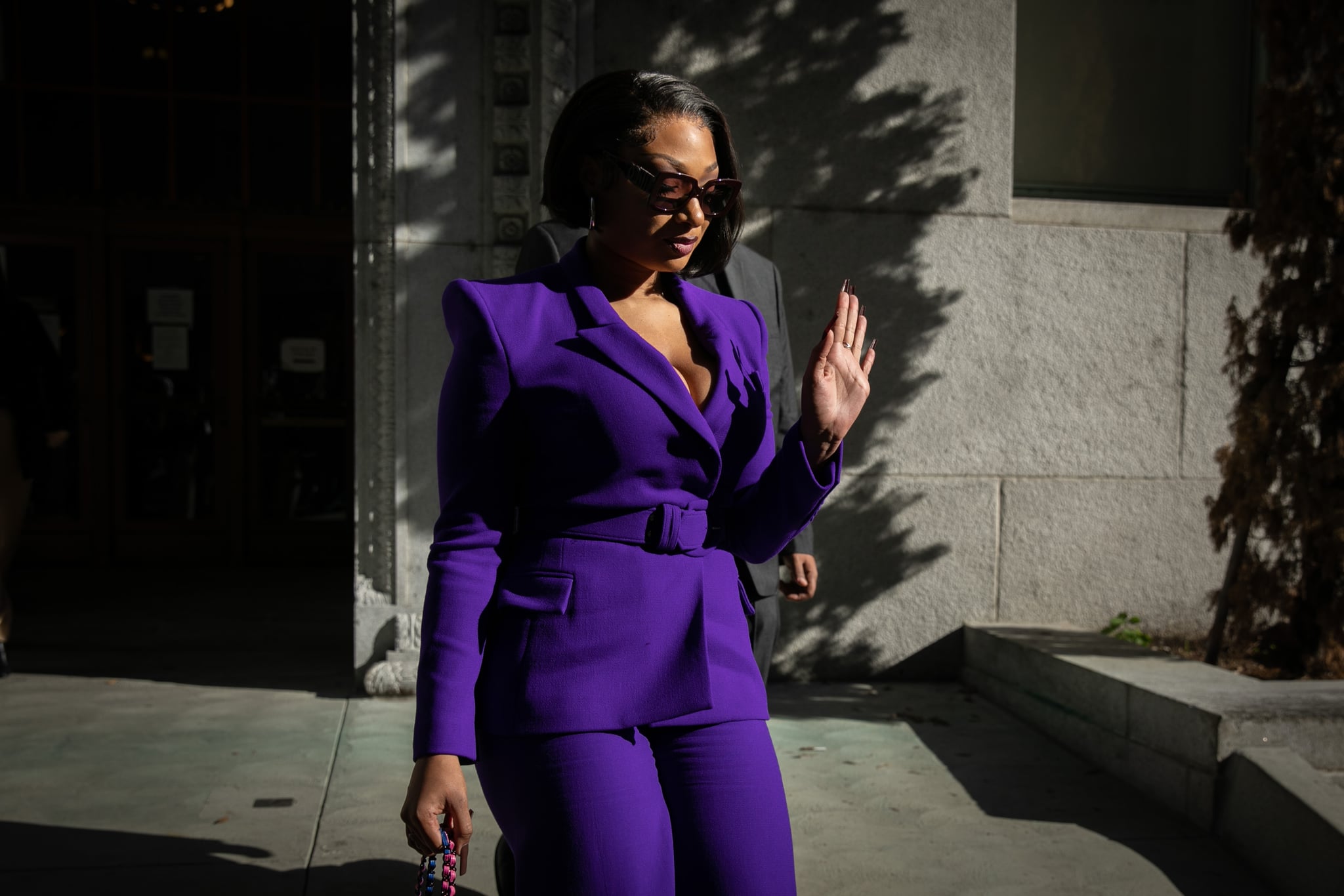 LOS ANGELES, CA - DECEMBER 13: Megan Thee Stallion whose legal name is Megan Pete makes her way from the Hall of Justice to the courthouse to testify in the trial of Rapper Tory Lanez for allegedly shooting her on Tuesday, Dec. 13, 2022 in Los Angeles, CA. (Jason Armond / Los Angeles Times via Getty Images)