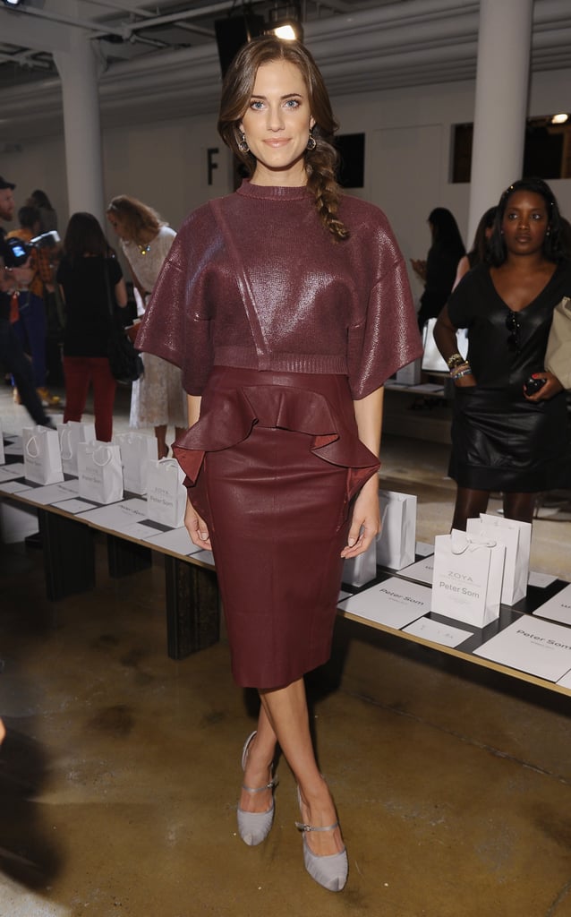 Allison showcased a monochromatic ensemble — a cropped metallic sweater and peplum leather pencil skirt — with satin ankle-strap pumps at Peter Som during Spring 2013 NYFW.