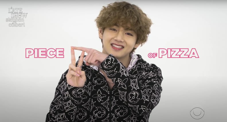 V From BTS Doing a "Pizza" Hand Gesture