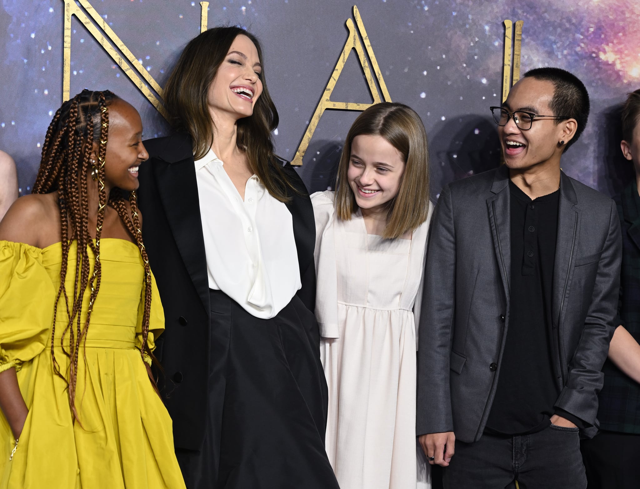 LONDON, ENGLAND - OCTOBER 27: (L-R) Zahara Jolie-Pitt, Angelina Jolie, Vivienne Jolie-Pitt and Maddox Jolie-Pitt attend the 