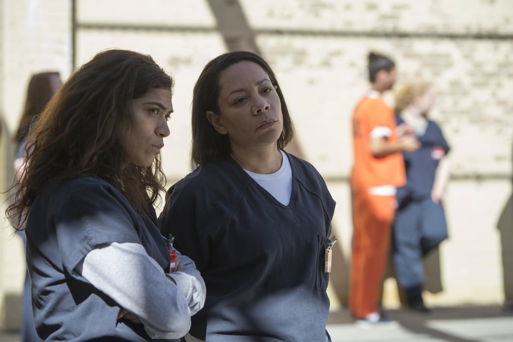 Blanca (Laura Gómez) and Gloria conspire in the courtyard.