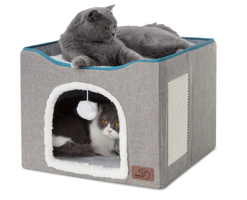 Bedsure Cat Bed ($30)
"My cats do get along, but they don't always want to be right next to each other. For the moments they want to stay close, they both climb on or into their Bedsure cave. One takes the top "bunk" and the other crawls inside, and they'll even play with each other by pawing at the hanging ball and reaching for each other every once in a while. It's adorable, and the sherpa lining is so comfortable, they'll spend hours sleeping in this same position." — SW