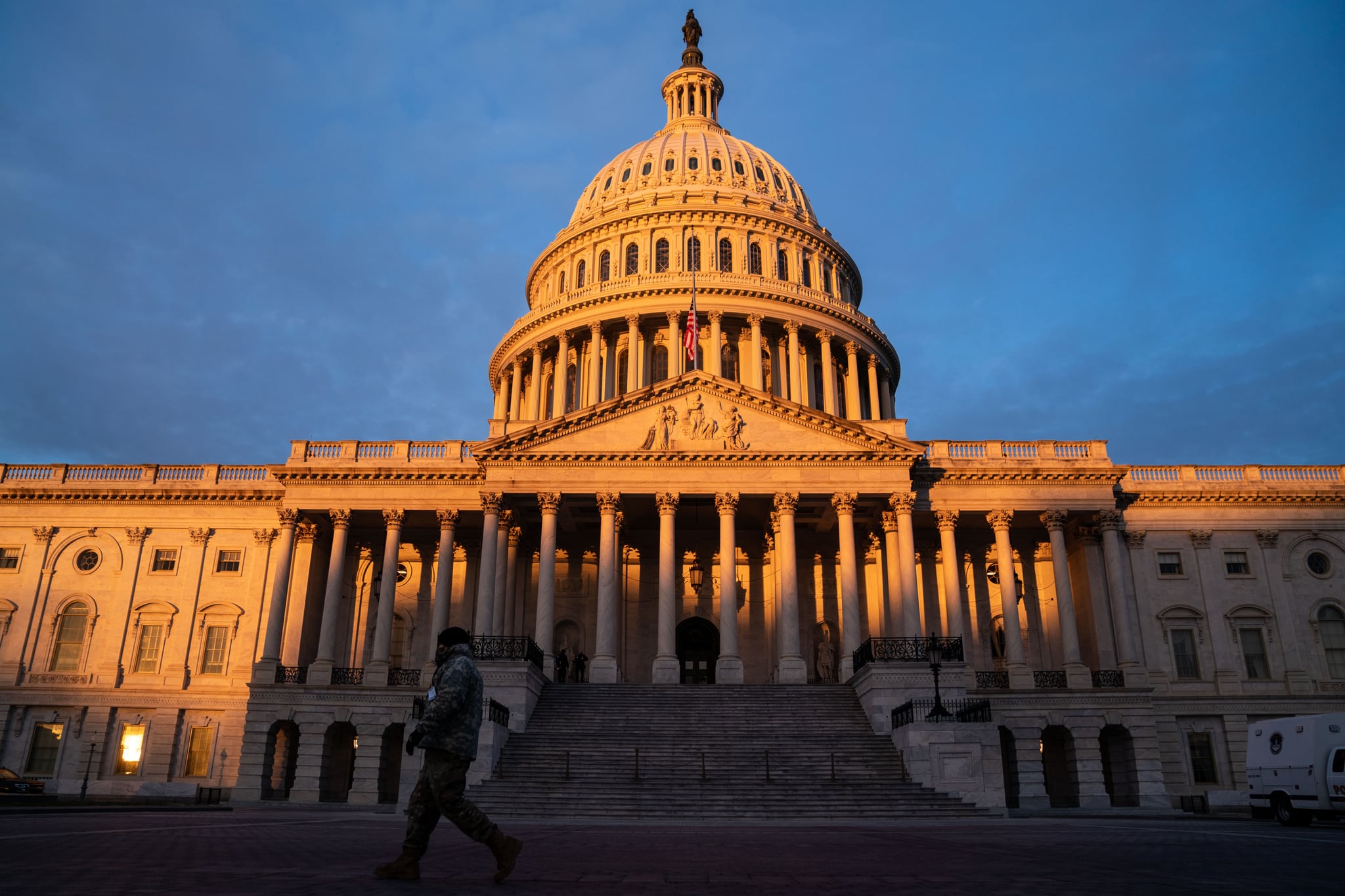 WASHINGTON, DC - JANUARY 11: The sun rises on the  U.S. Capitol Building, where heightened security measures are in place nearly a week after a pro-Trump insurrectionist mob breached the security of the nations capitol while Congress voted to certify the 2020 Election Results on Monday, Jan. 11, 2021 in Washington, DC. (Kent Nishimura / Los Angeles Times via Getty Images)