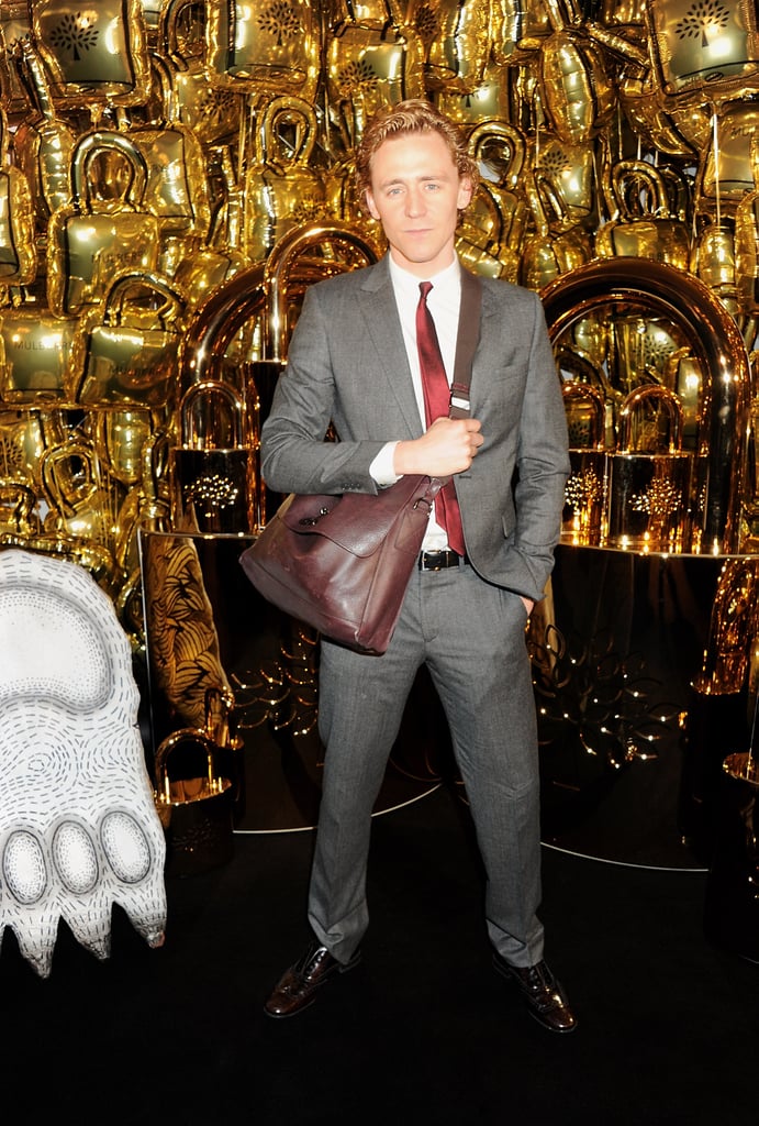 Tom modeled a man bag.