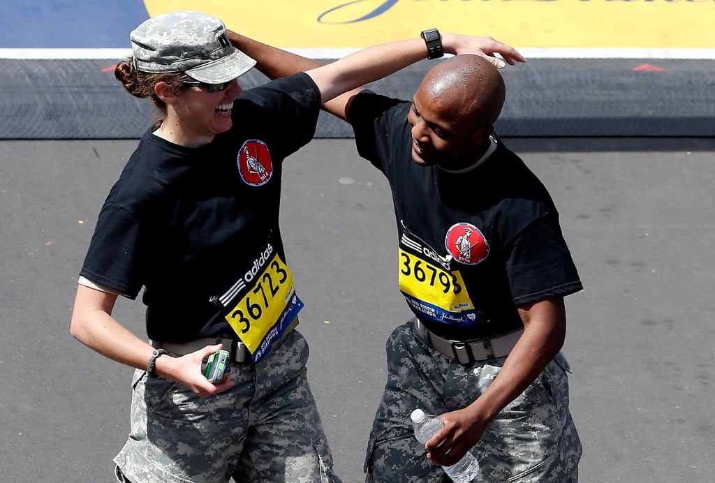 Two soldiers celebrated after completing the marathon together.