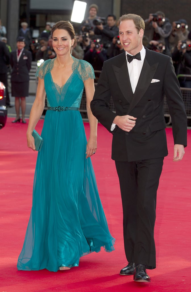 Middleton left us breathless in a teal Jenny Packham gown, featuring a plunging neckline, lace insets, and a jeweled belt, while walking the BOA Olympic Concert red carpet with Prince William in May 2012.