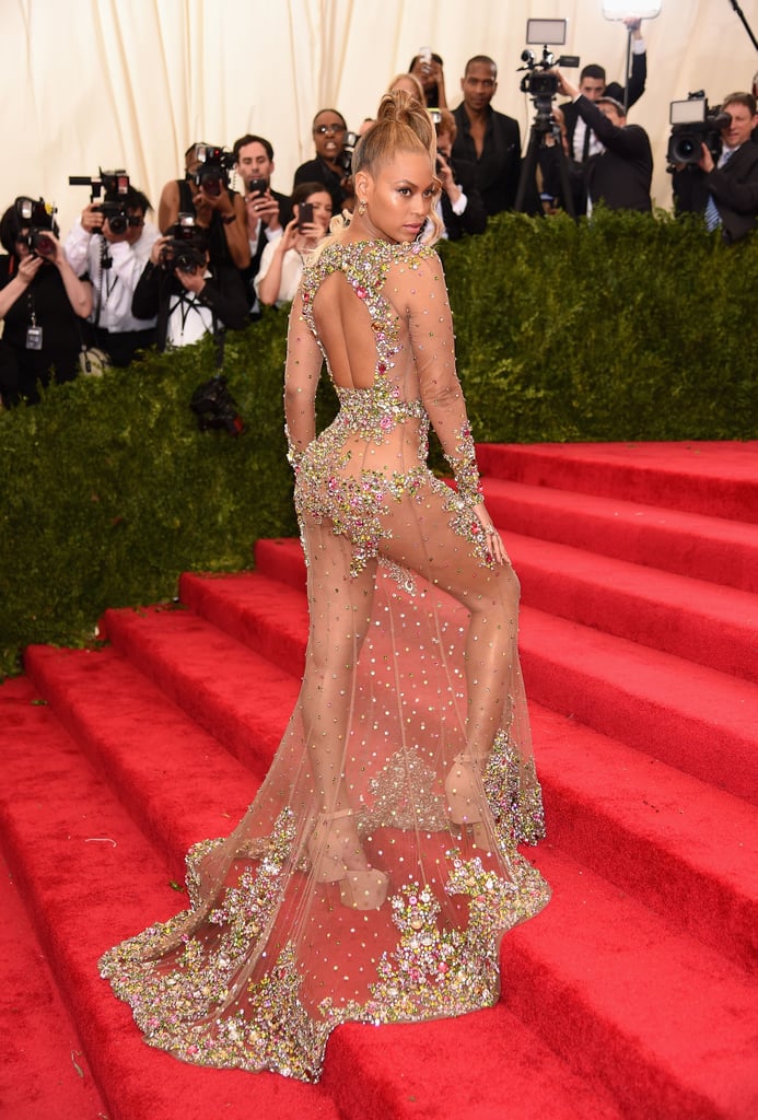 Wearing an embellished sheer Givenchy gown to the Met Gala in 2015.