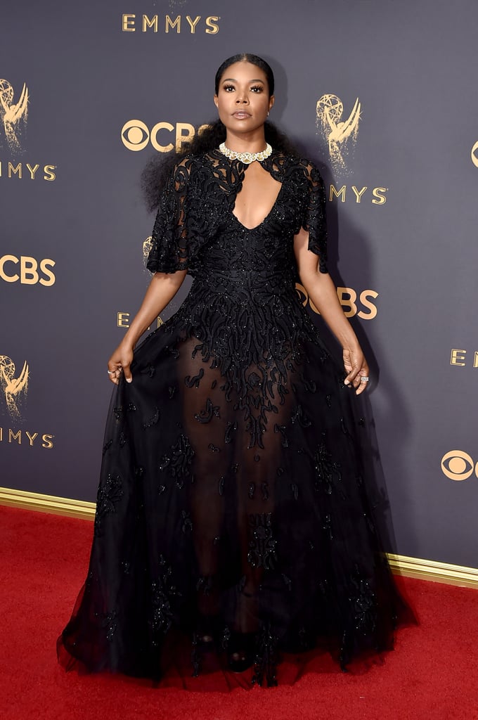 Judging by Gabrielle Union's red carpet look, she's taking her role as a presenter seriously . . . very seriously. Union stunned with her husband, Dwyane Wade, by her side in a black beaded cape gown with a sheer full-length skirt from Zuhair Murad. The Being Mary Jane star topped off her look with a dazzling diamond necklace and strappy black Buccellati heels.