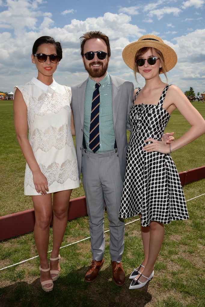 The blue and cloudy sky was the backdrop of Olivia, Aaron, and Dakota's day at the polo event.