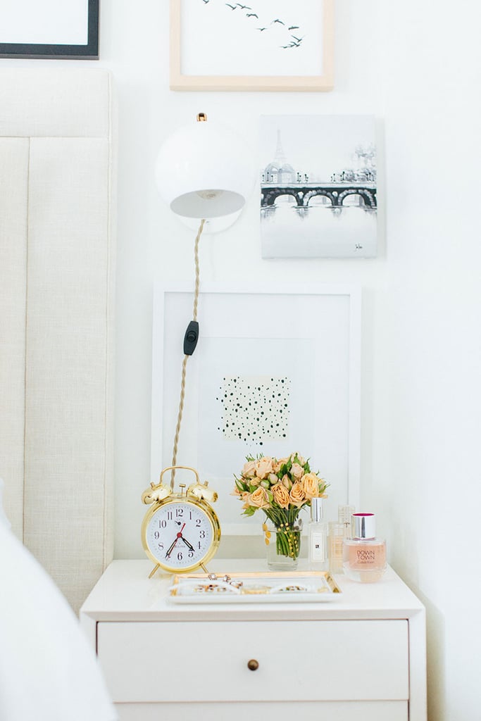 By using a mounted wall light above her nightstand, Alaina freed up space for knickknacks and flowers next to her bed. By using a mounted wall light above her nightstand, Alaina freed up space for knickknacks and flowers next to her bed.