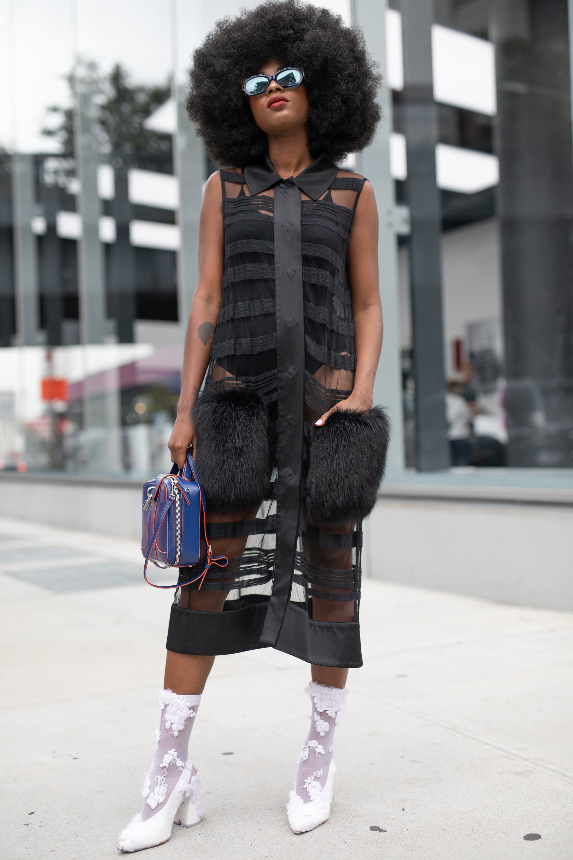 Styling a black sheer dress with a bodysuit.