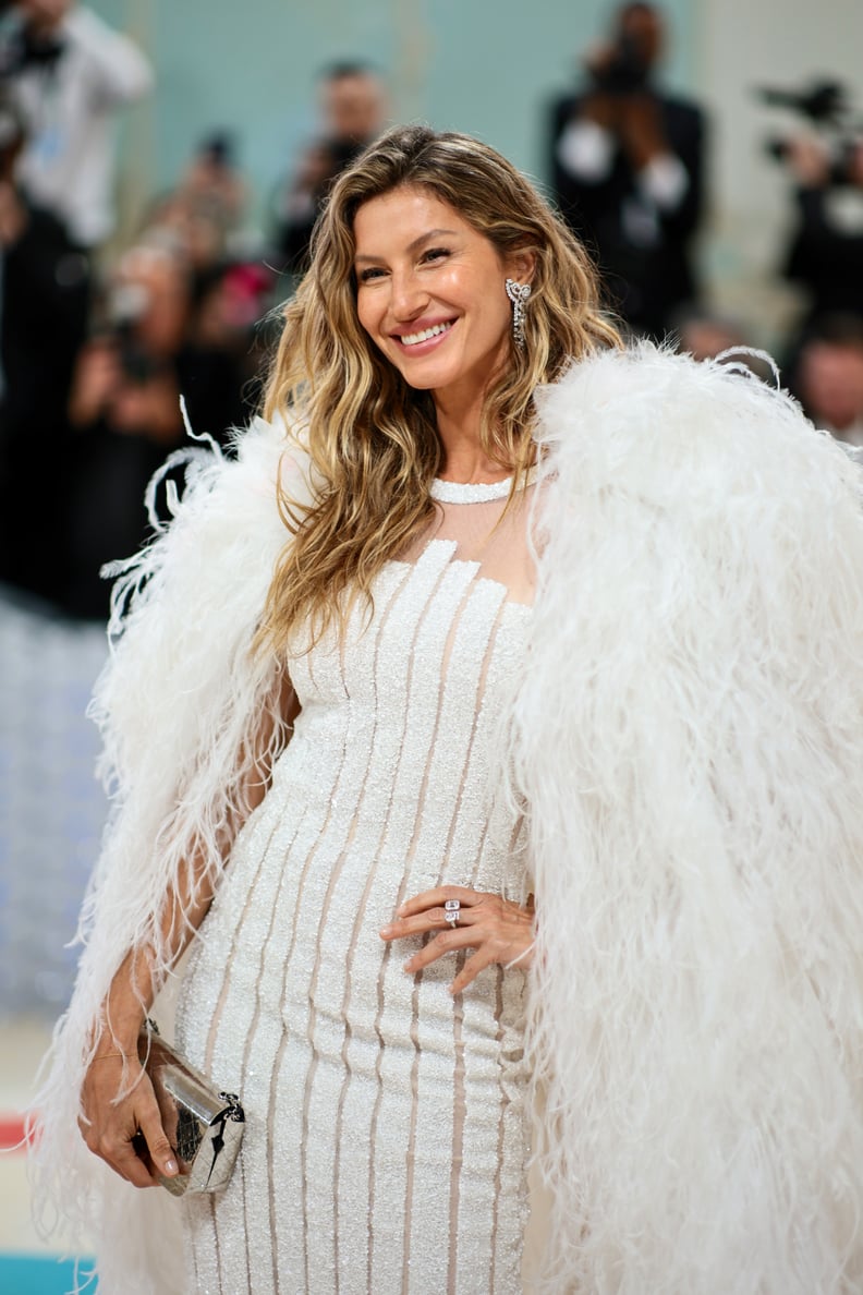 Gisele Bündchen attends the 2023 Met Gala with supermodel nails and effortless beachy hair. 