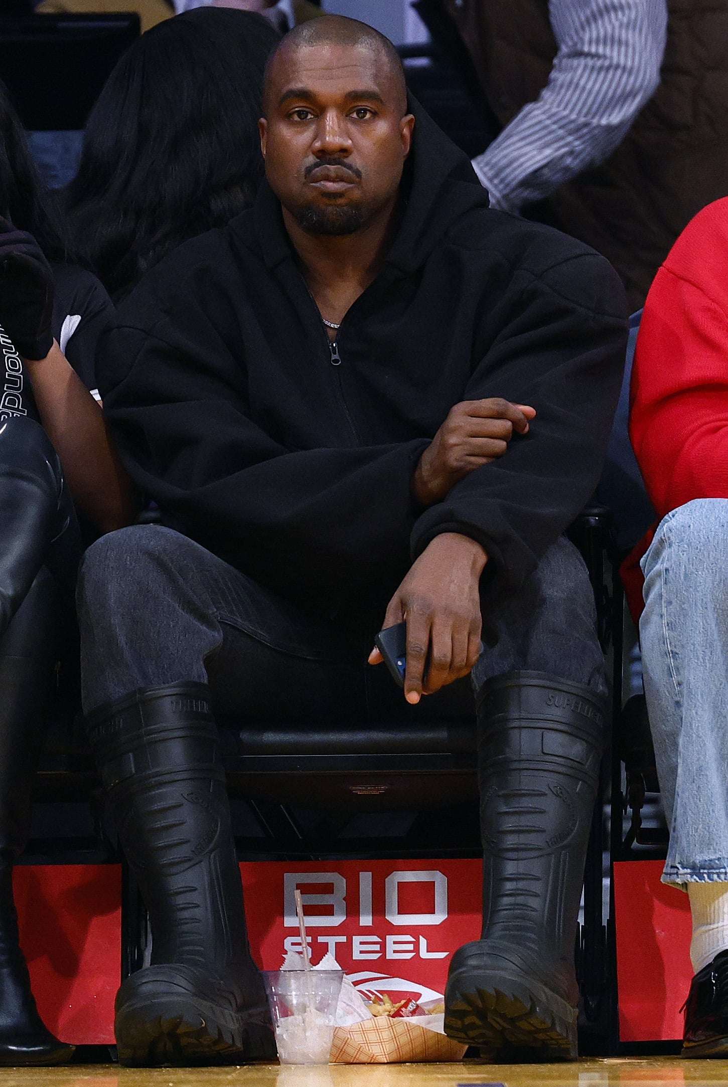 LOS ANGELES, CALIFORNIA - MARCH 11:  Rapper Kanye West attends a game between the Washington Wizards and the Los Angeles Lakers in the fourth quarter at Crypto.com Arena on March 11, 2022 in Los Angeles, California.  NOTE TO USER: User expressly acknowledges and agrees that, by downloading and/or using this Photograph, user is consenting to the terms and conditions of the Getty Images Licence Agreement. (Photo by Ronald Martinez/Getty Images)