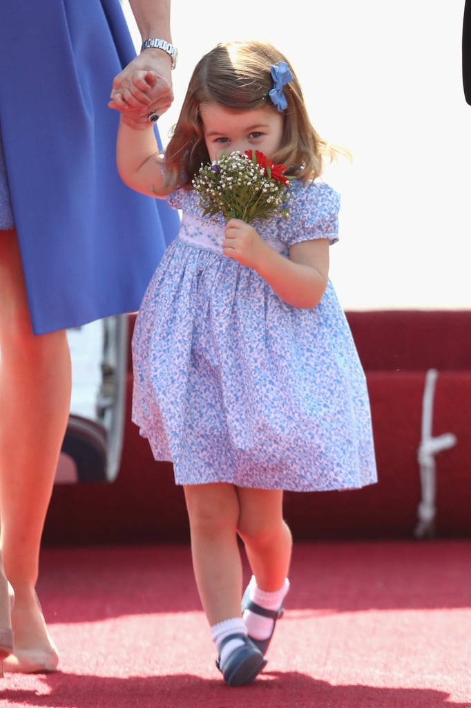 Princess Charlotte literally stopped to smell the flowers while visiting Germany with her parents in July.
