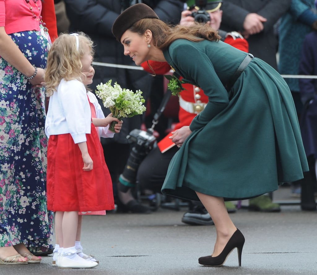 Kate bent down to chat eye to eye with a young fan in Aldershot, England, on St. Patrick's Day in 2012.