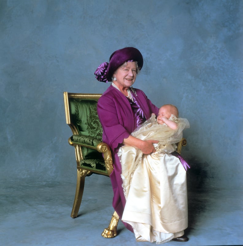 Queen Elizabeth, the Queen Mother, holds Prince Harry After His Christening