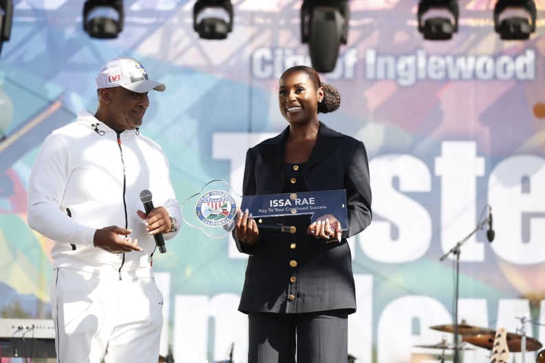 INGLEWOOD, CALIFORNIA - FEBRUARY 12: Inglewood Mayor James Butts presents Issa Rae with first ever City of Inglewood key to the city on stage during the Taste Of Inglewood Experience presents Market Street Vibez Pre-Game Extravaganza on February 12, 2022 