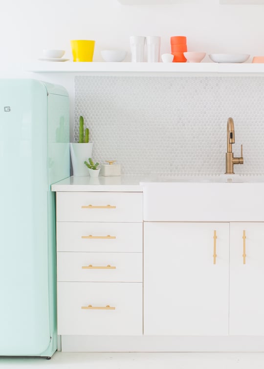 The former mermaid would love this bright pop of seafoam green in her kitchen.