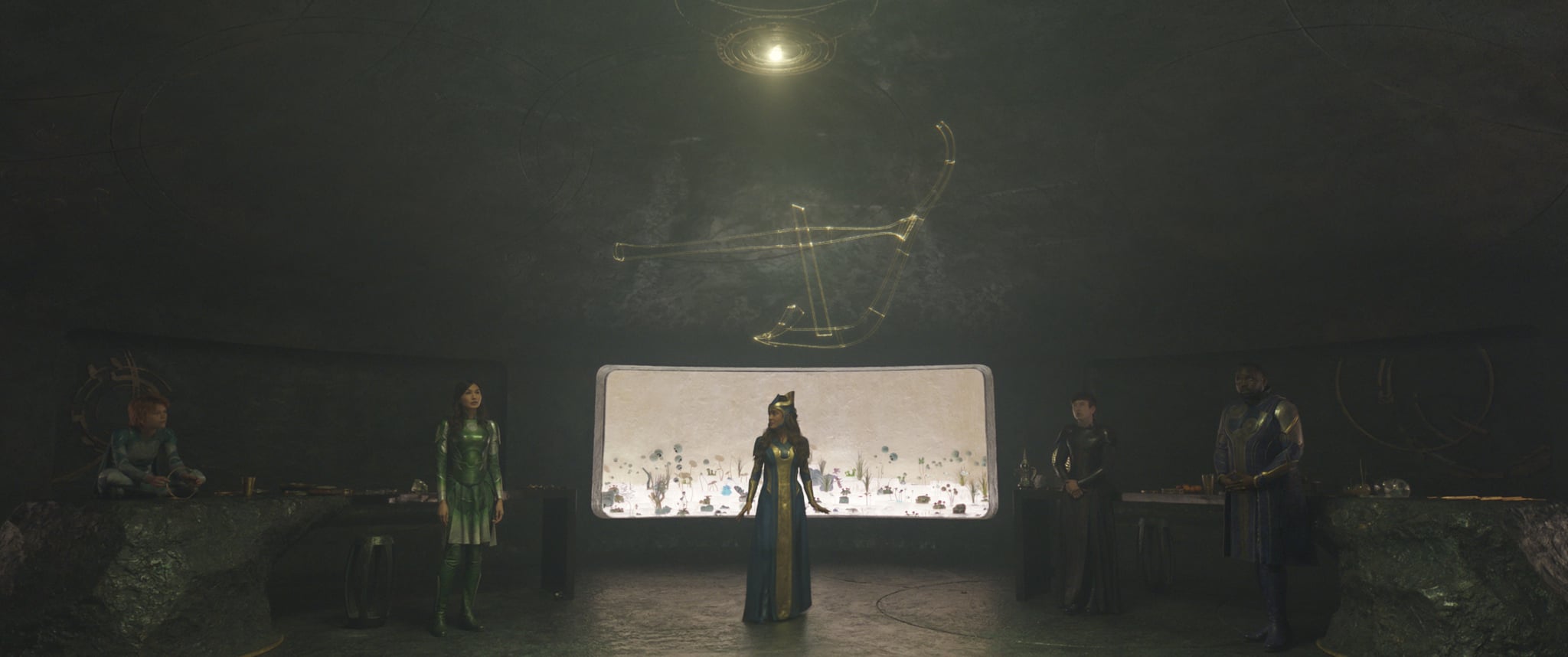 Sprite (Lia McHugh), Sersi (Gemma Chan), Ajak (Salma Hayek), Druig (Barry Keoghan), and Phastos (Brian Tyree Henry) in Marvel Studios' ETERNALS. Photo courtesy of Marvel Studios. ©Marvel Studios 2021. All Rights Reserved.