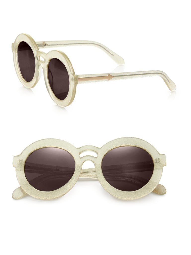 The subtle glitter frames of these
<product href="http://www.saksfifthavenue.com/main/ProductDetail.jsp?PRODUCT%3C%3Eprd_id=845524446690741&site_refer=AFF001&mid=13816&siteID=J84DHJLQkR4-o5HGtmUpV46e488mWFKkzQ&LSoid=462170&LSlinkid=15&LScreativeid=410784275813">Karen Walker Joyous Plastic Round Sunglasses</product> ($250) are quirky without looking kooky.