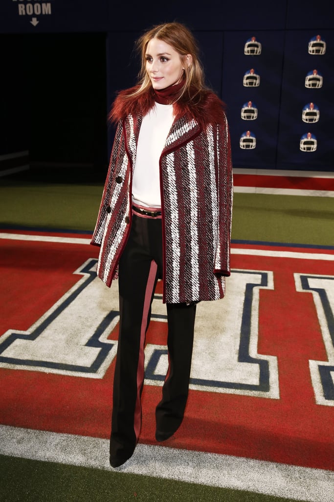 Now this is a style touchdown! At Tommy Hilfiger, Olivia wore a striped red, white, and black coat with color-coordinated separates.