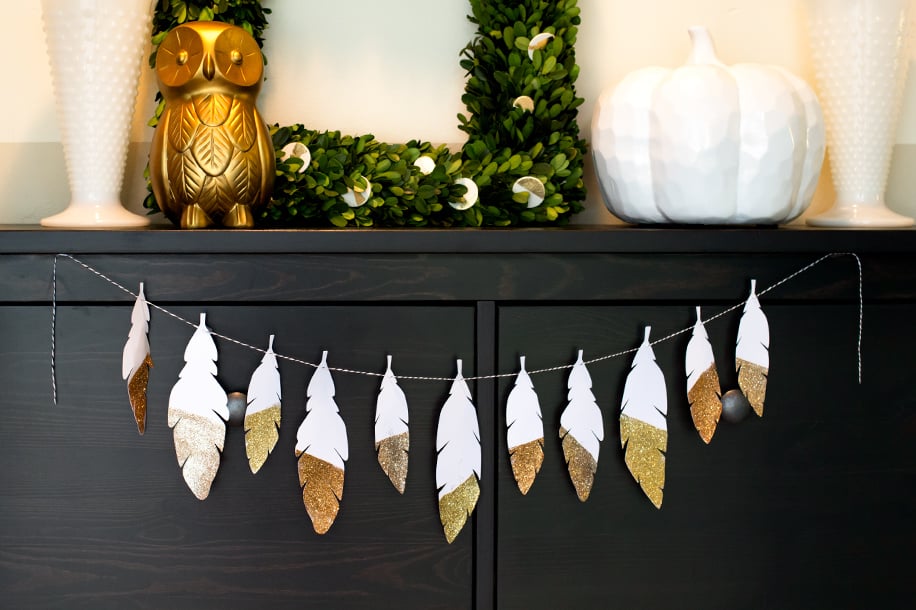 Feather decor is super trendy and perfectly on season for Thanksgiving. This DIY glitter garland is the perfect way to tie in the trend while enhancing your home's natural beauty for your Thanksgiving celebration.