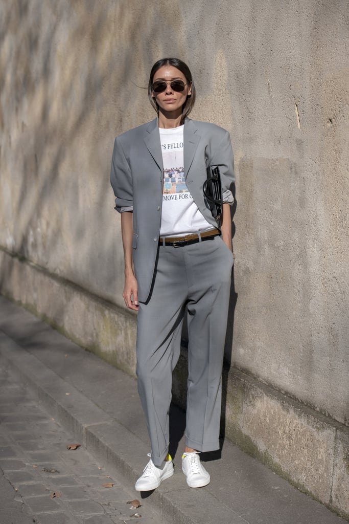 Give your suit an achingly cool feel by styling with a t-shirt and sneakers.