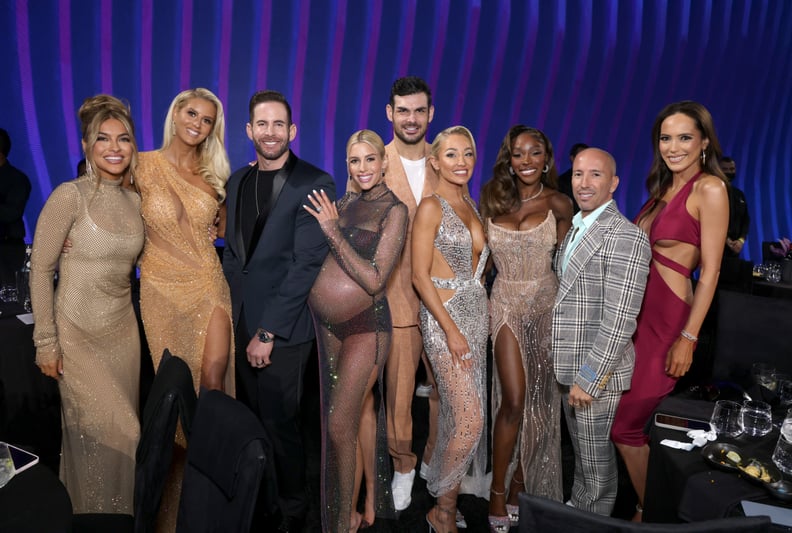 SANTA MONICA, CALIFORNIA - DECEMBER 06: 2022 PEOPLE'S CHOICE AWARDS -- Pictured: (l-r) Chrishell Stause, Emma Hernan, Tarek El Moussa, Heather Rae El Moussa, Romain Bonnet, Mary Fitzgerald, Chelsea Lazkani, Jason Oppenheim and Davina Potratz on stage duri