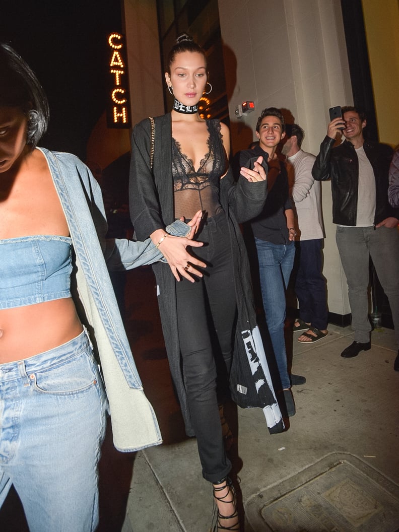 Bella Hadid Paired Her Black Jeans With a Sheer Bodysuit, a Duster, and Lace-Up Heels