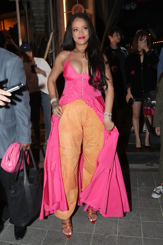 Rihanna Wearing a Pink Dress and Orange Pants in Seoul