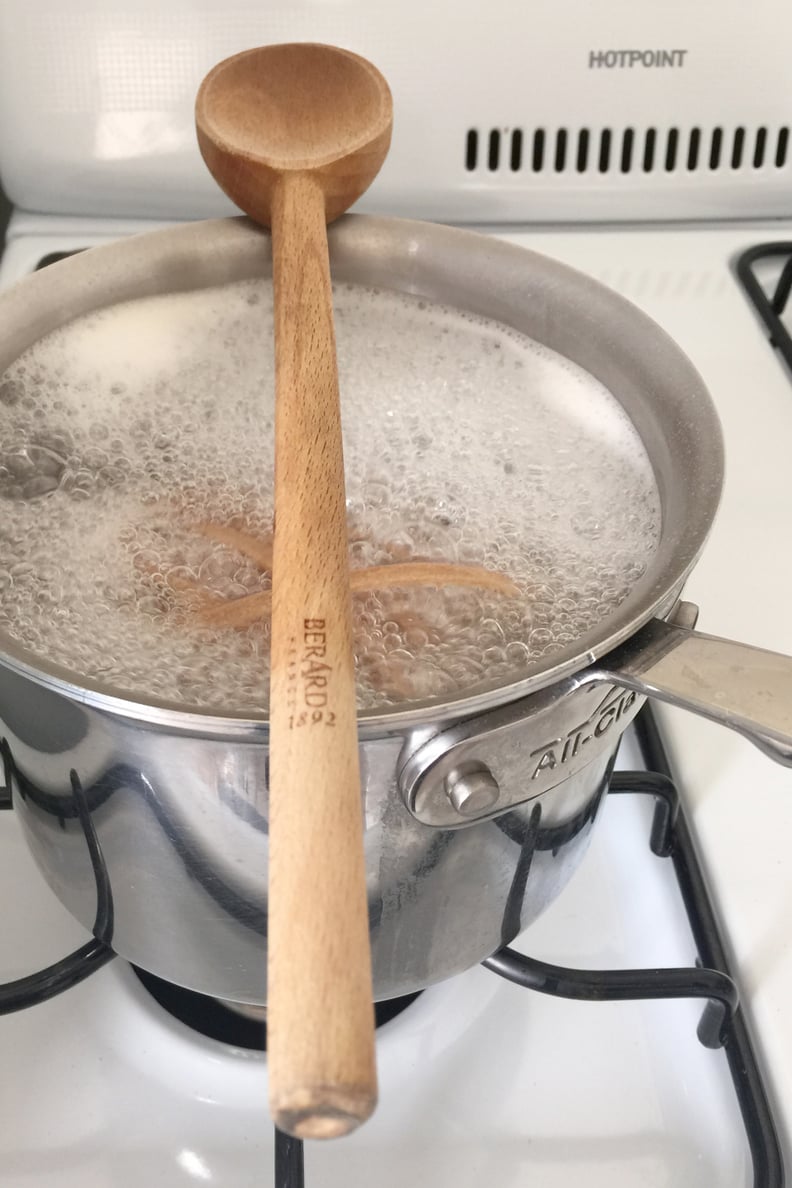 Place a wooden spoon over the top of the pot to prevent the water from boiling over.