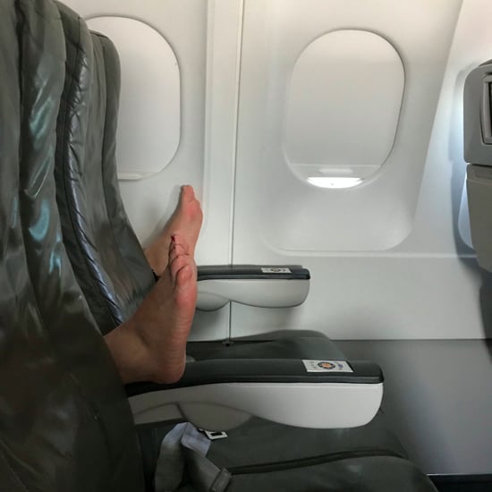 Person Puts Feet on Plane Chair