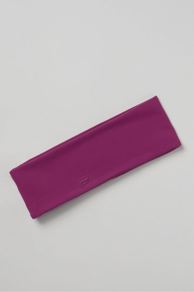 Fabletics The Powergrip Pureluxe Headband ($30)
No matter how long or short your hair is, there is nothing more uncomfortable (or annoying) than constantly having to swipe stray hairs out of your face. This thick headband is made of quick-dry material and has a nonslip band on the inside to keep your style secure for miles on end.