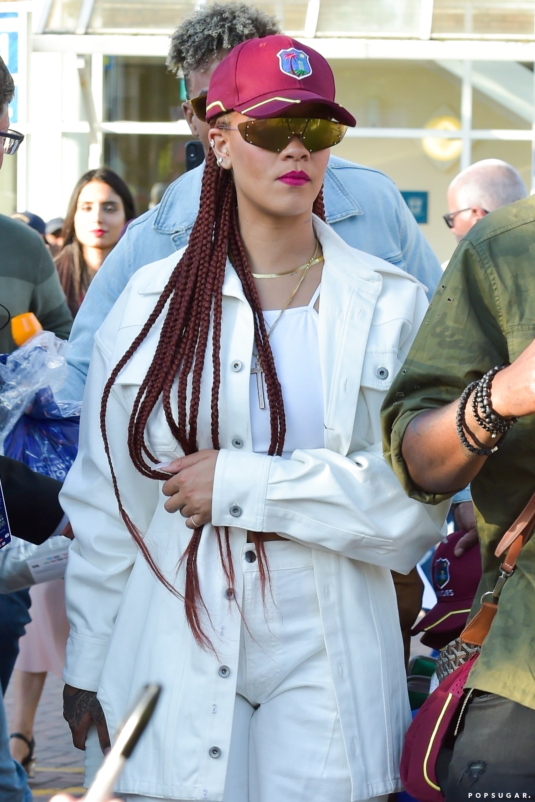Rihanna Wearing a Baseball Cap and White Jeans PS Fashion