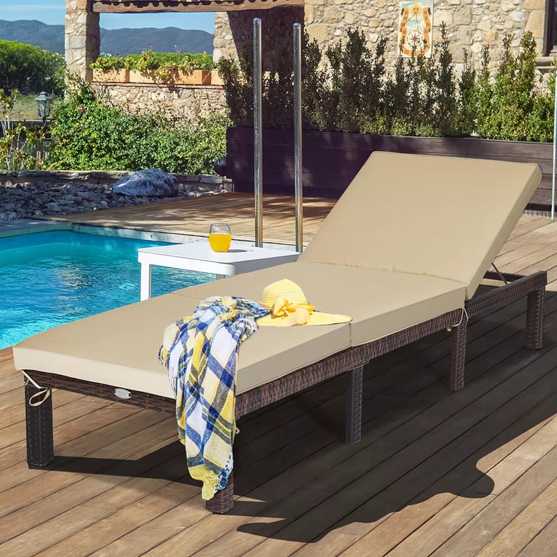 A Lounger: Costway Outdoor Rattan Lounge Chair